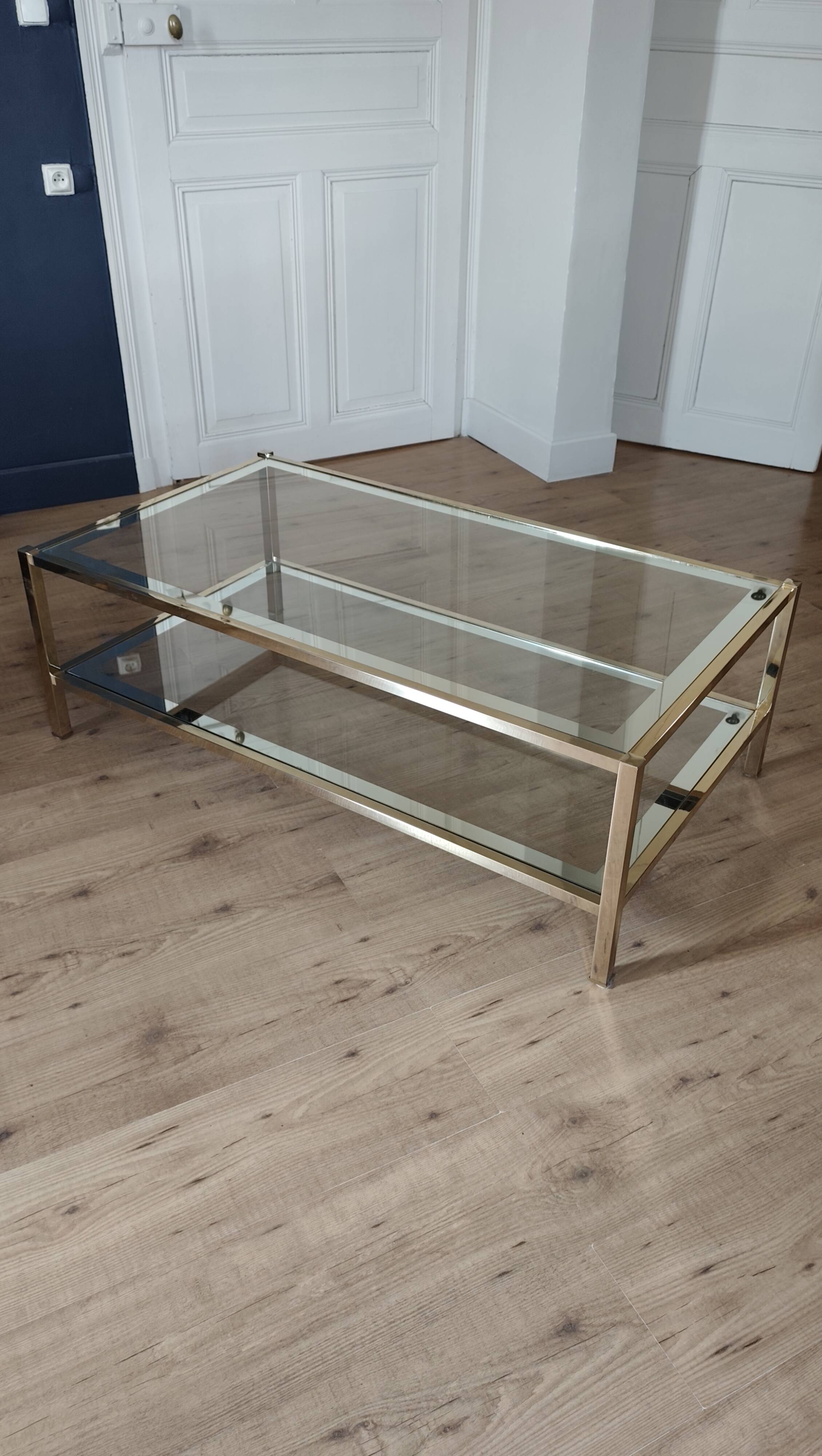Vintage coffee table with glass, mirror, and brass.