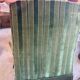 Set of two green velvet toad armchairs with fringe