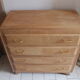 Commode aux pieds compas en bois brut