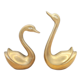 Two brass swans