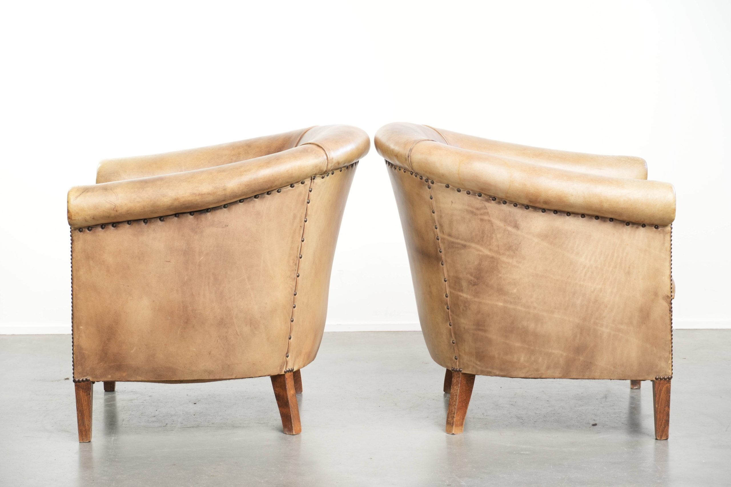 Set of two vintage cowhide club armchairs in English style