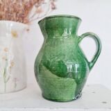 Antique green pitcher in painted terracotta
