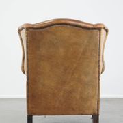 Patinated sheep leather wingback armchair