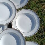 Twelve white porcelain plates