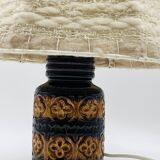 Vintage ceramic lamp with relief and wool shade.