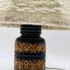 Vintage ceramic lamp with relief and wool shade.
