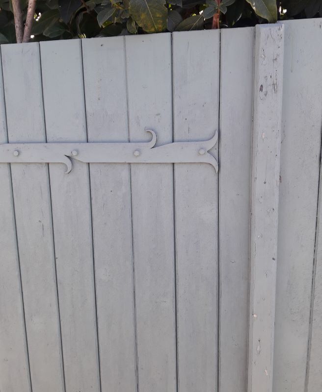 Pair of wooden shutters hanging iron