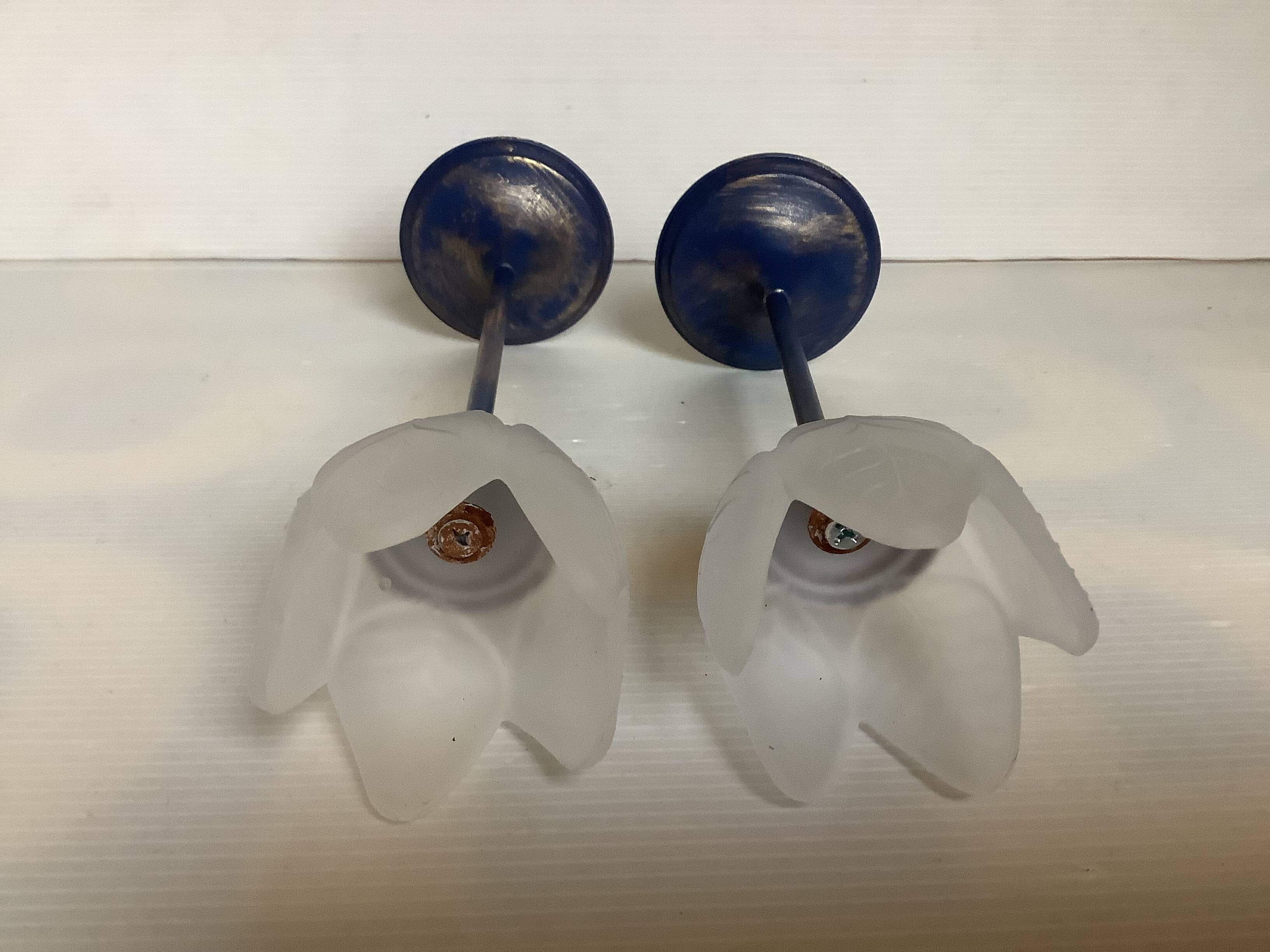 Pair of glass and metal flower candlesticks