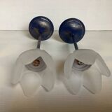 Pair of glass and metal flower candlesticks