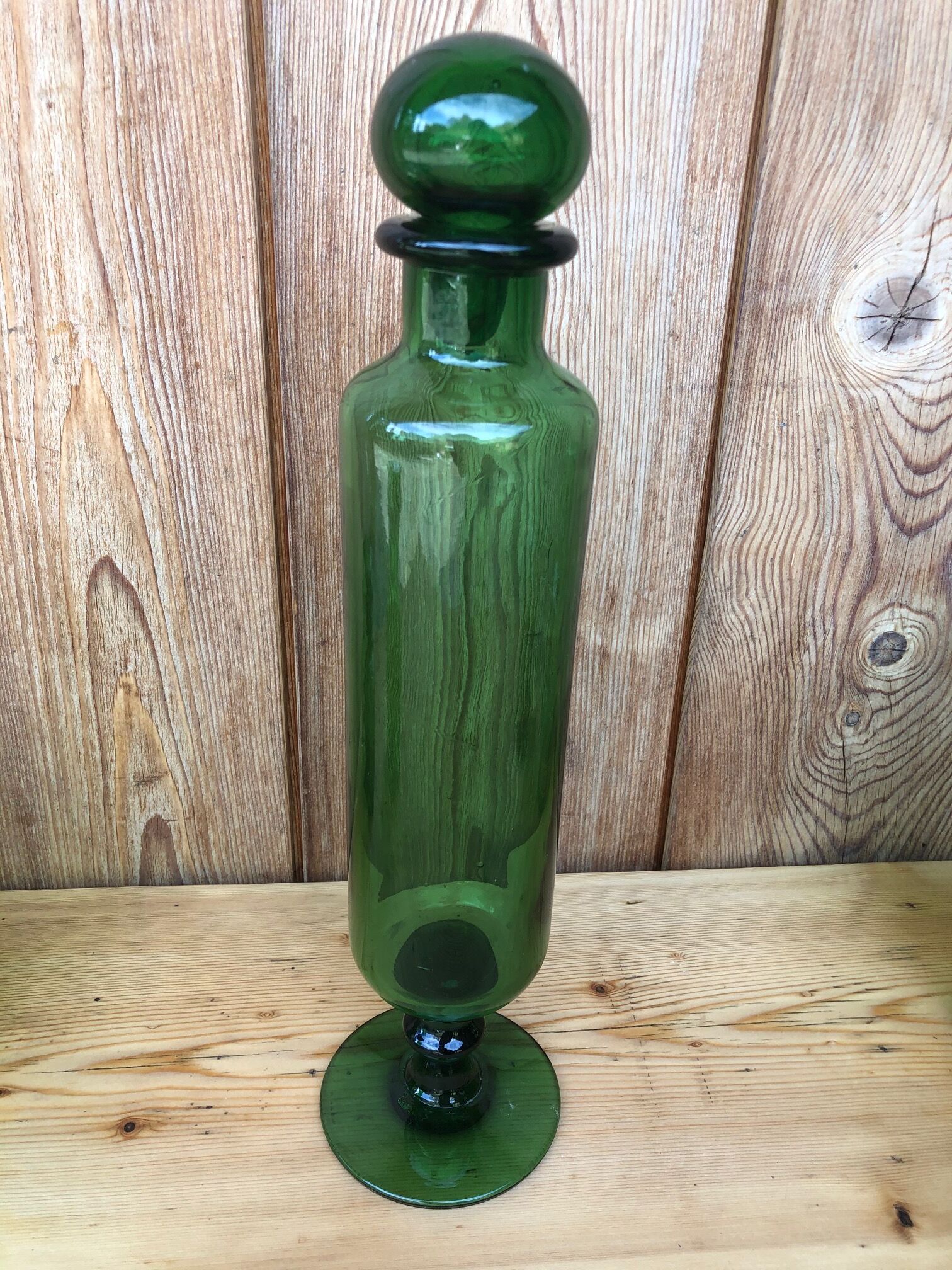 Green glass standing apothecary bottle