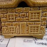 Devonway jam pot in the shape of a cottage with a thatched roof.