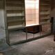 Ivory-colored and matte gold anodized aluminum display bookcase
