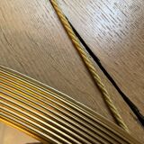 Antique oval beveled mirror adorned with tassels