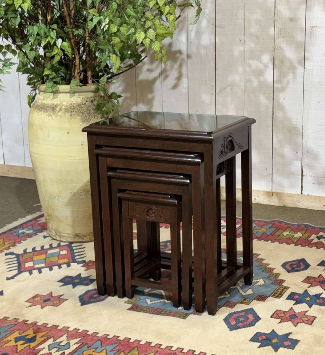 Set of 4 Chinese nesting tables in teak from the 1980s.