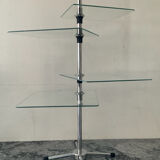 A pair of vintage side tables in glass and chrome metal.