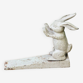 Ancien cale porte lapin en fonte