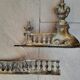Louis XVI style bronze andirons and fireplace bar