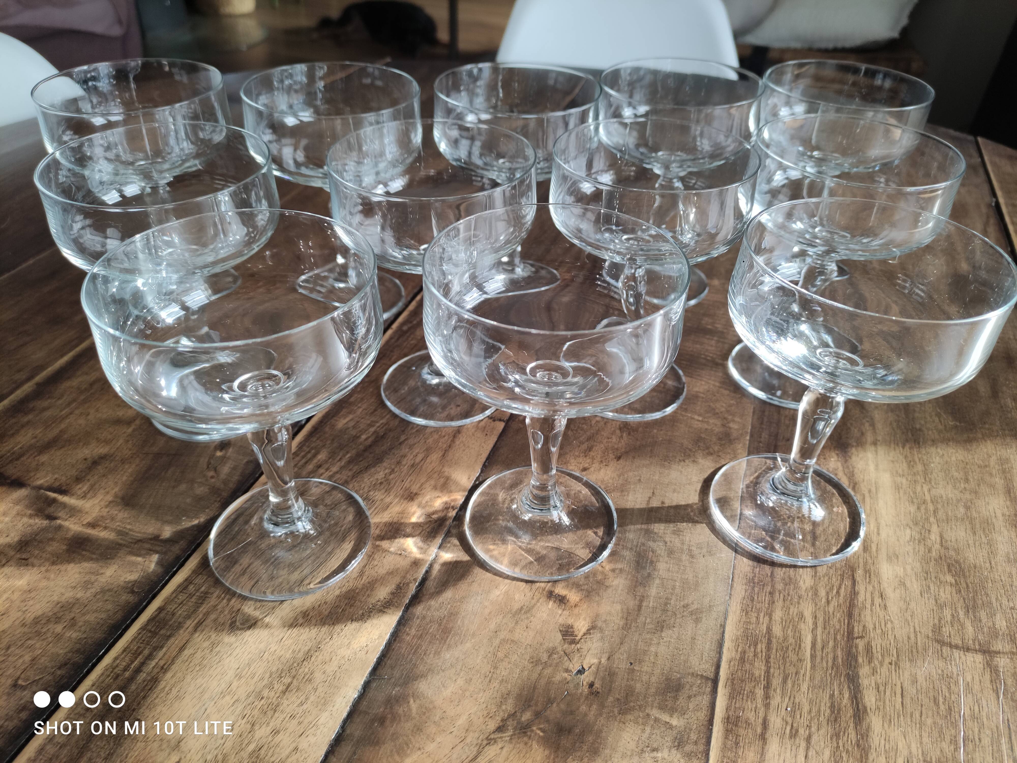 Set of 12 vintage glass champagne glasses with curved foot