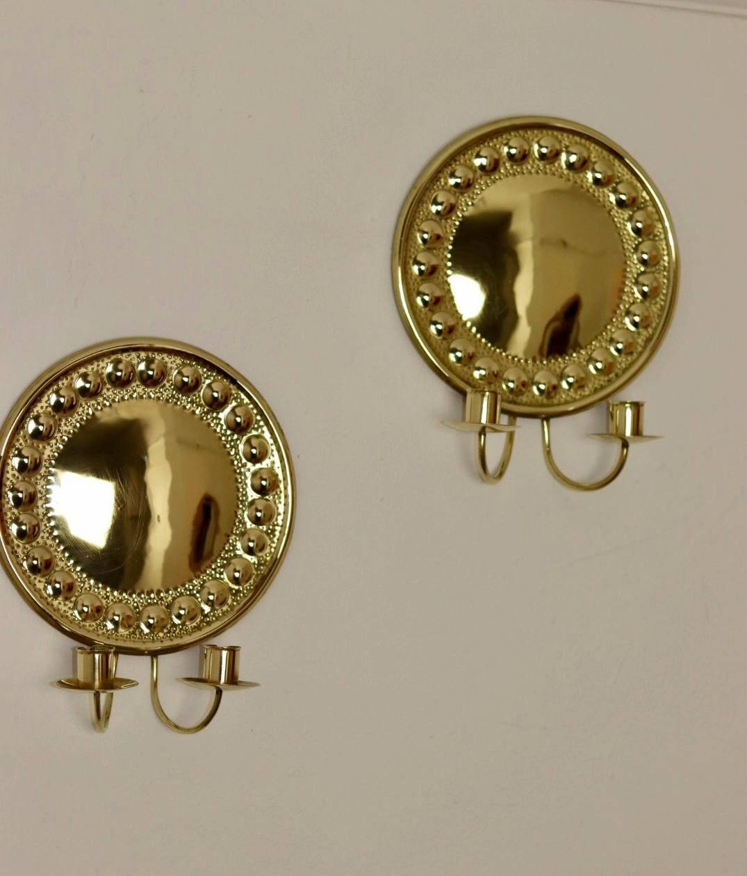 A pair of Swedish brass wall lights from the 1970s.