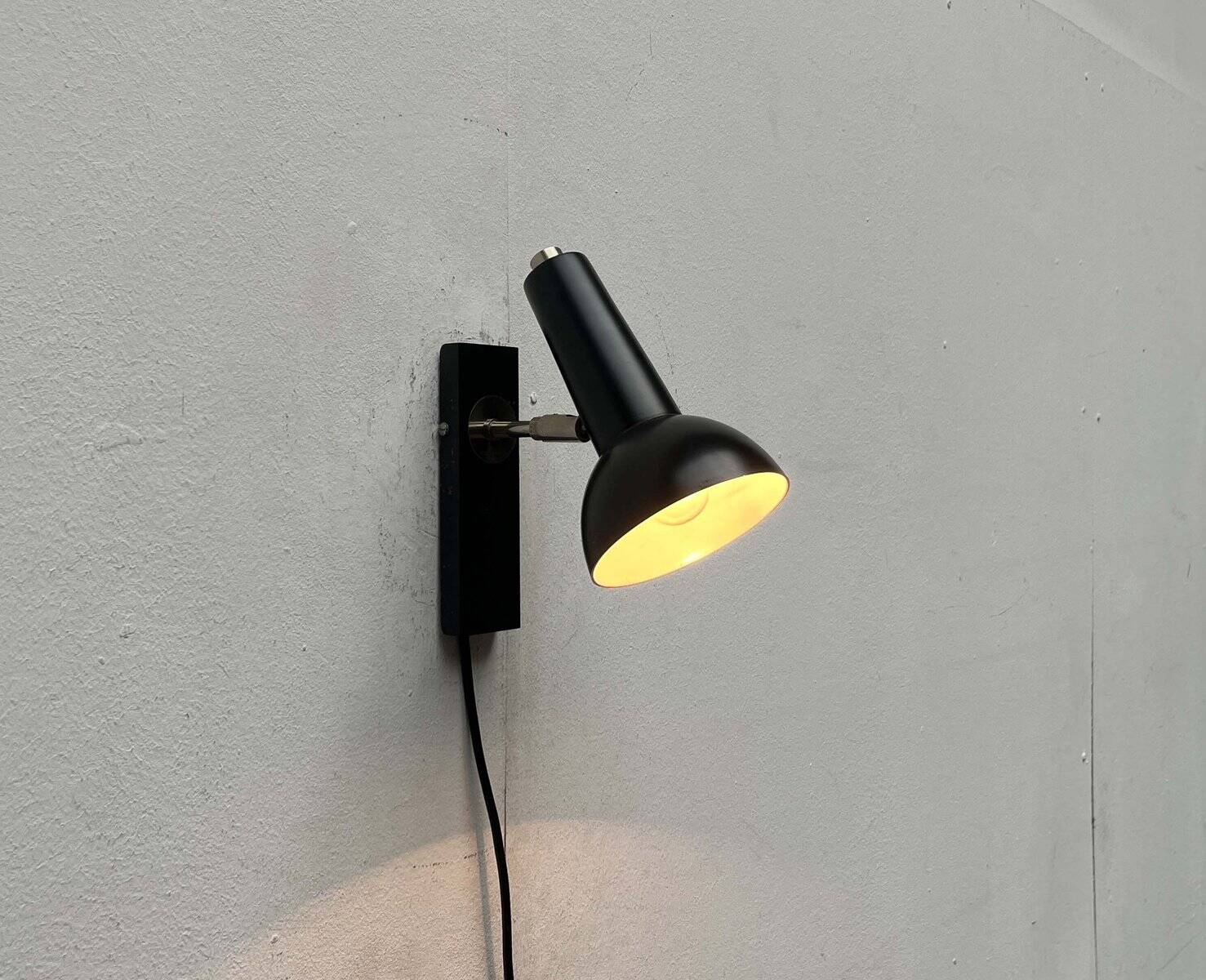 Mid-century German black minimalist wall lamp by Hustadt, 1960s.