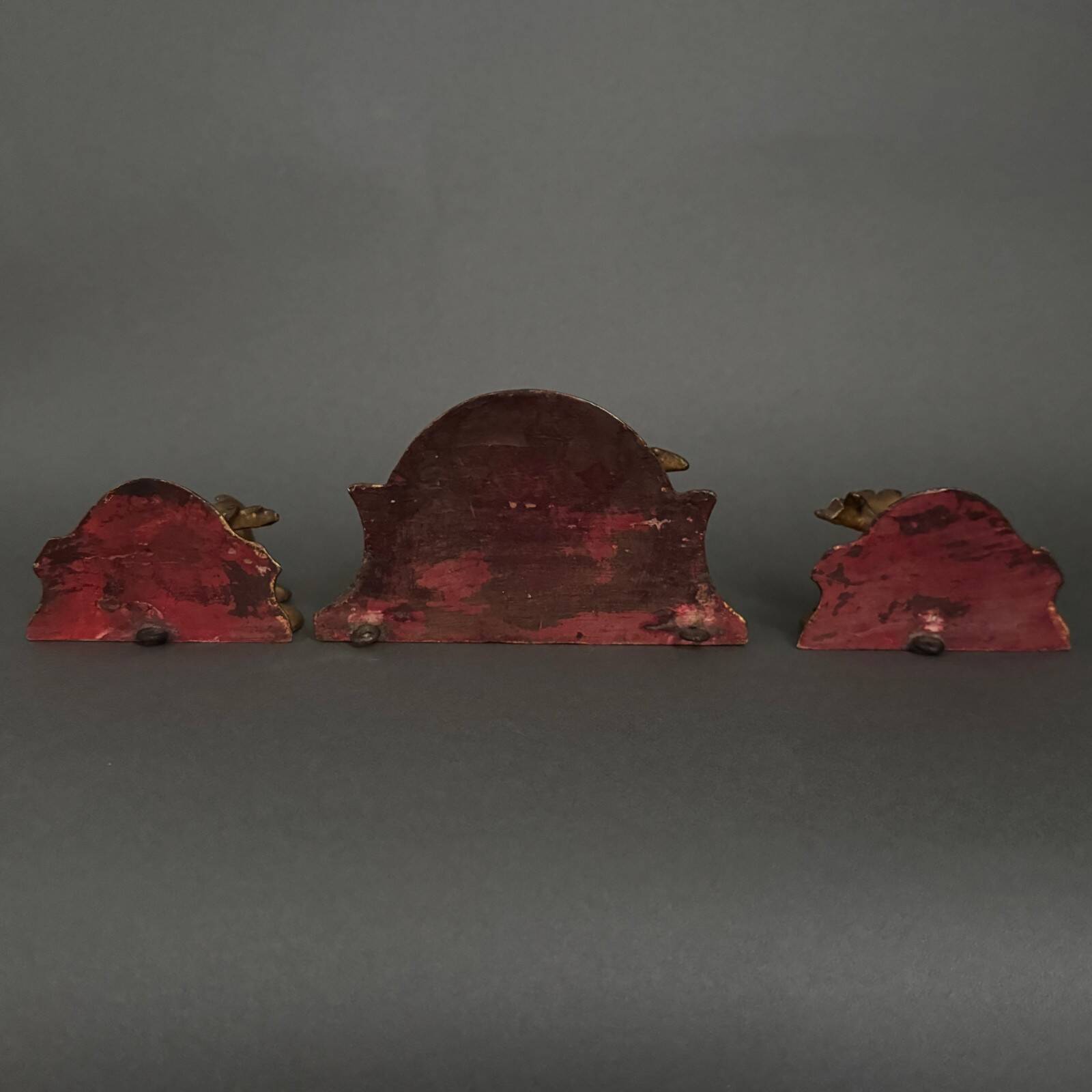 Set of three gilded wood consoles in Rococo style, late 19th century.
