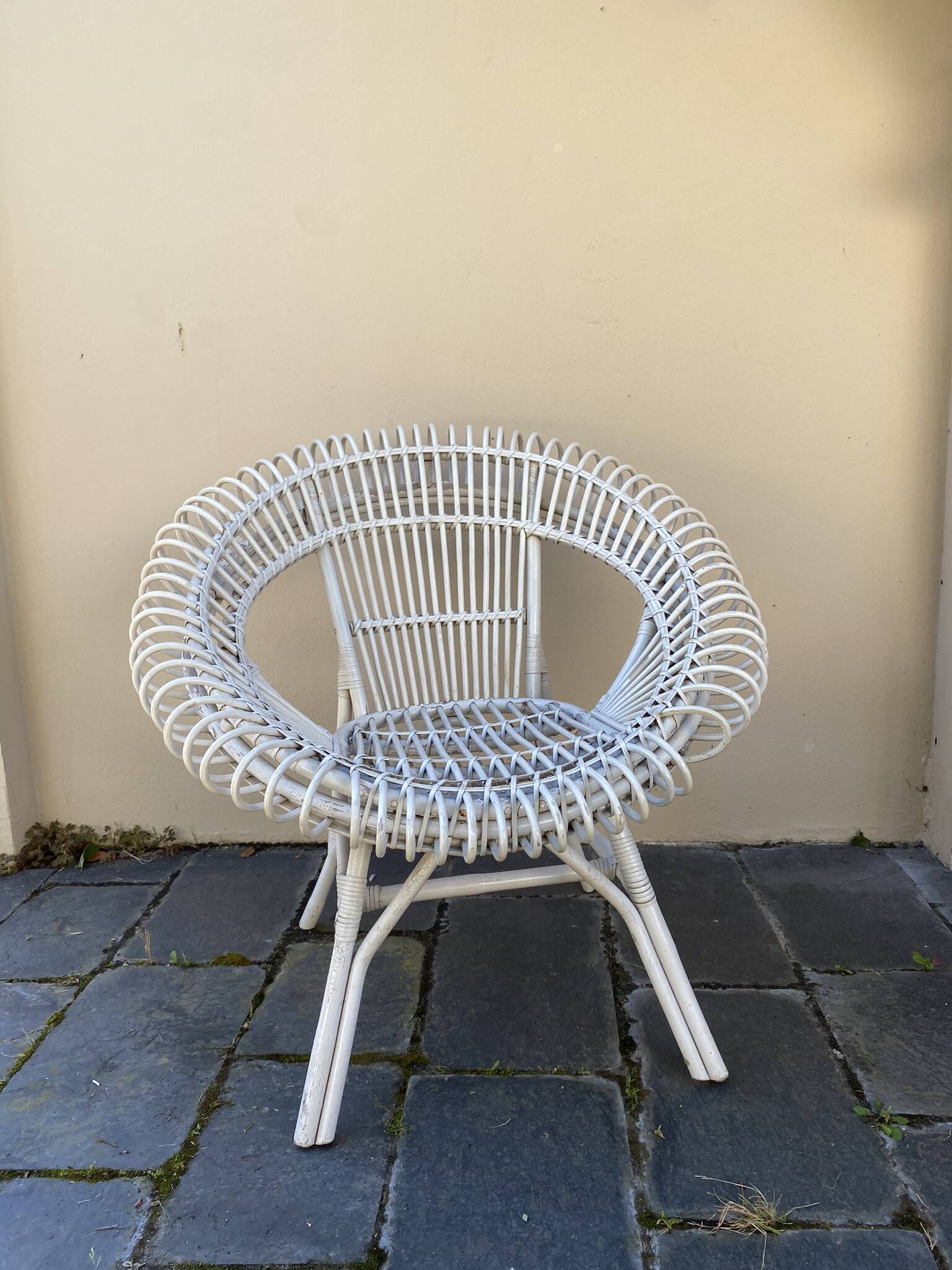Vintage white rattan armchair