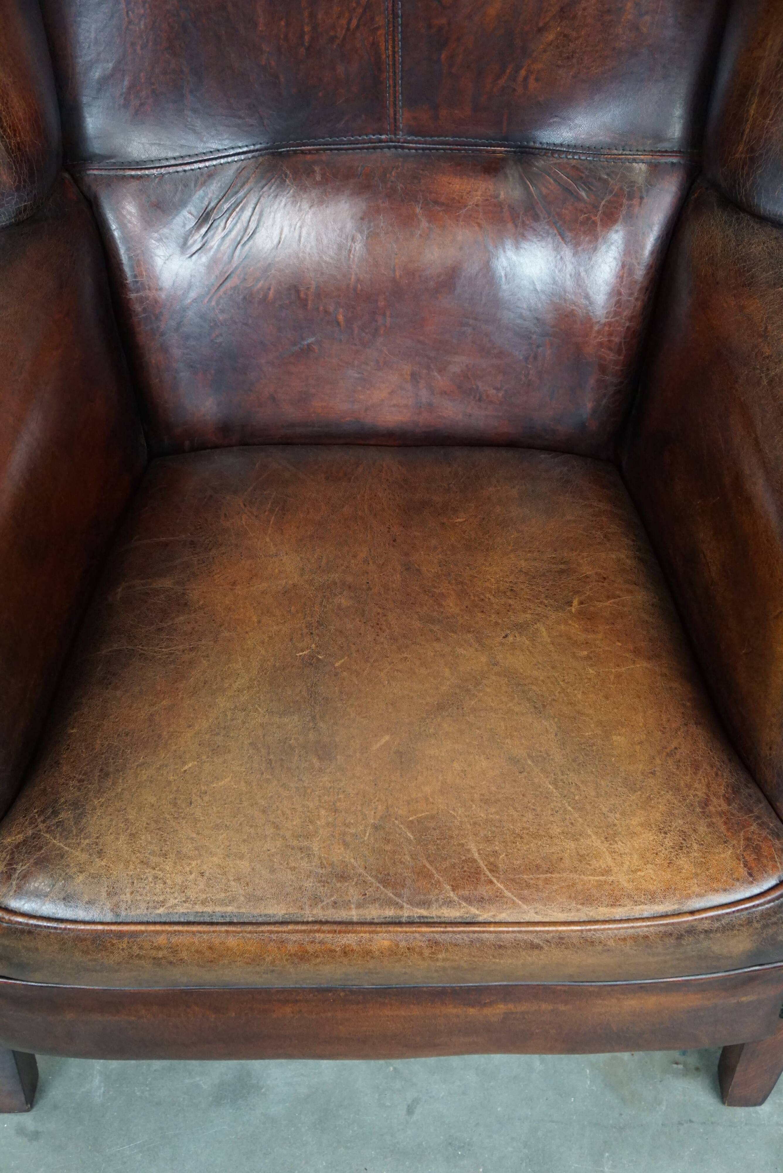 Large Sheepskin Leather Wingback Armchair with a Fixed Seat Cushion and a Stunning Patina