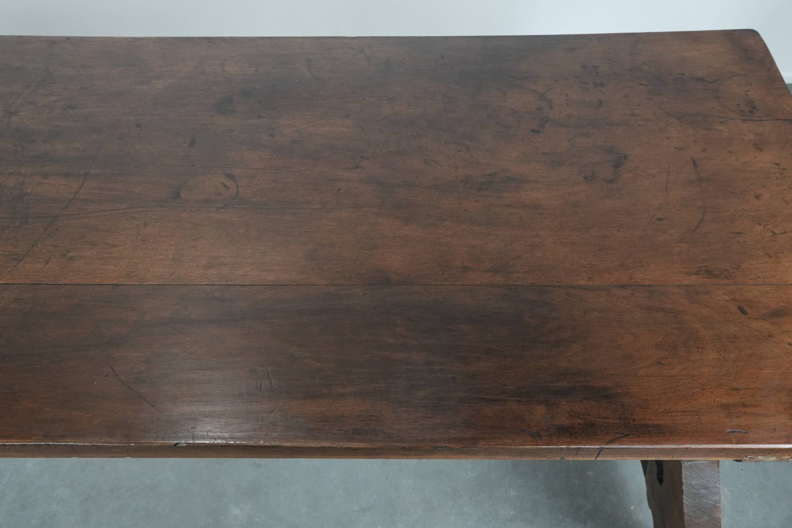 Antique 18th-century Spanish dining table with a wrought iron base