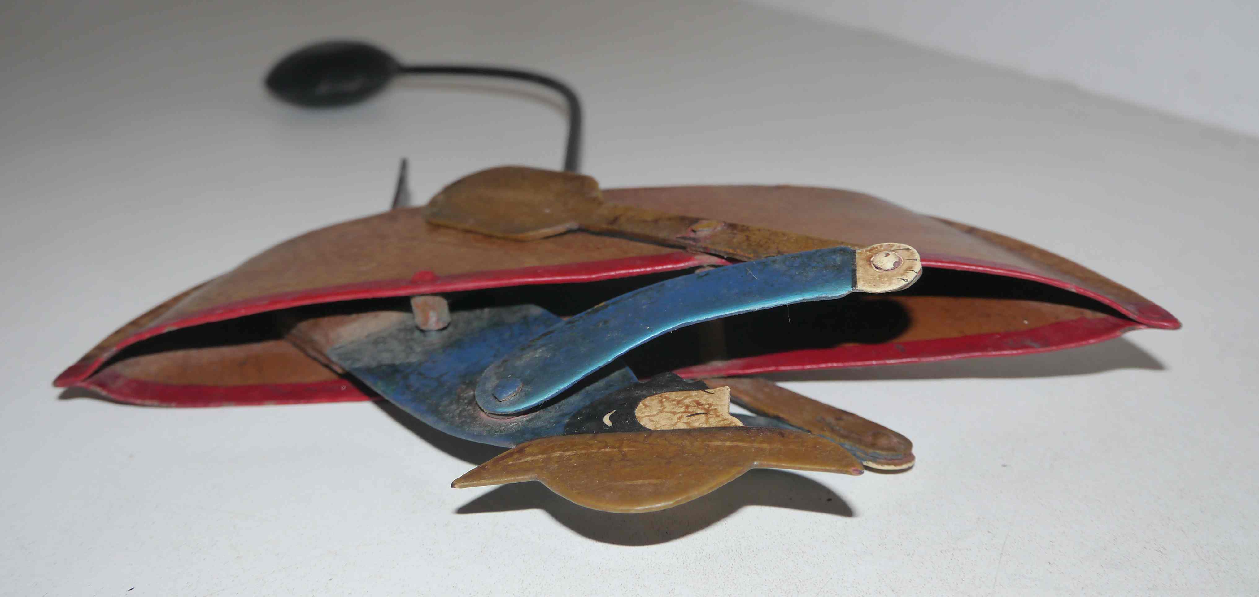 Old fishing counter balance toy in a boat