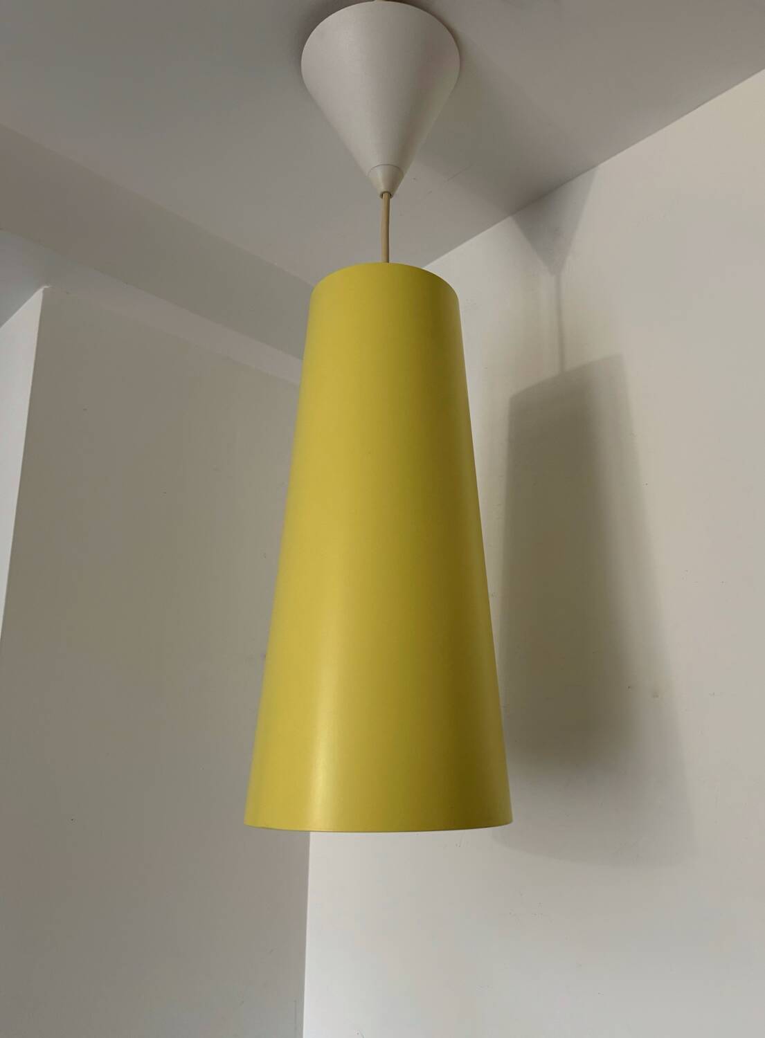 IKEA yellow metal cylindrical pendant light from the 2000s