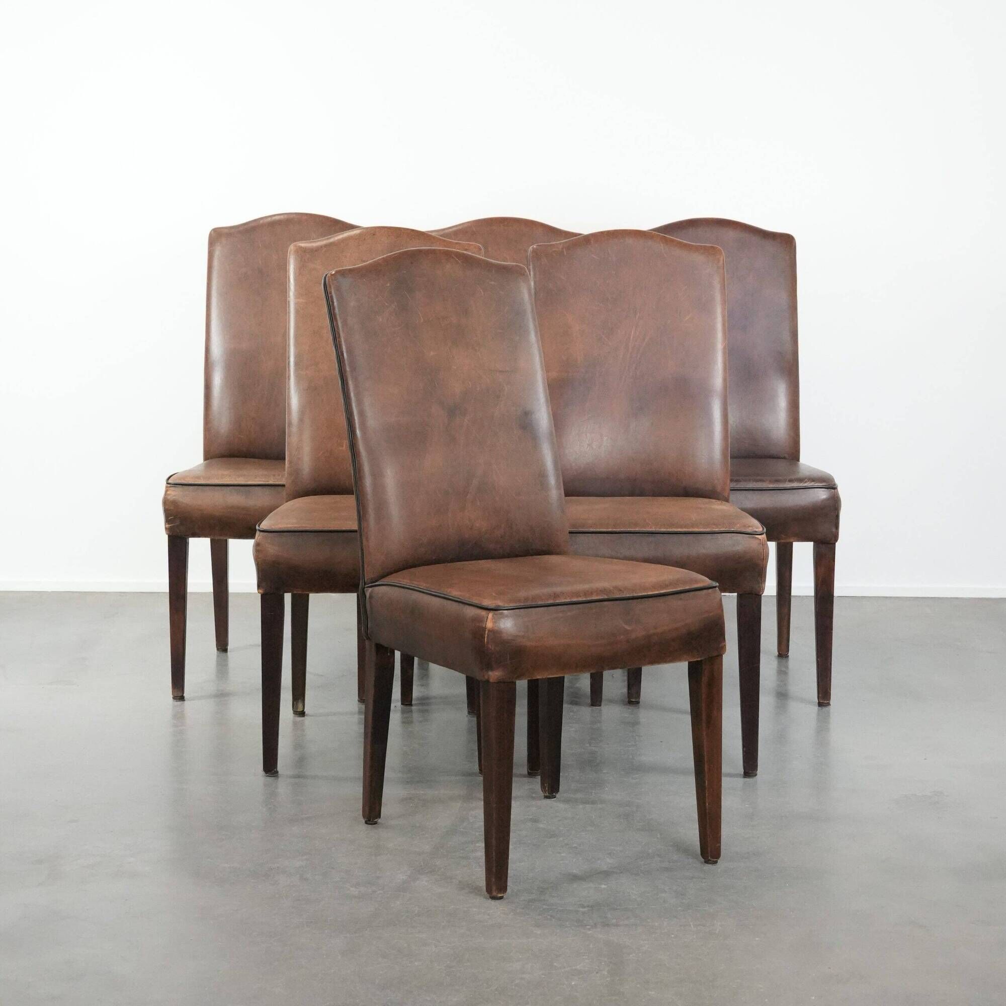 Set of 6 vintage sheepskin dining chairs finished with black piping