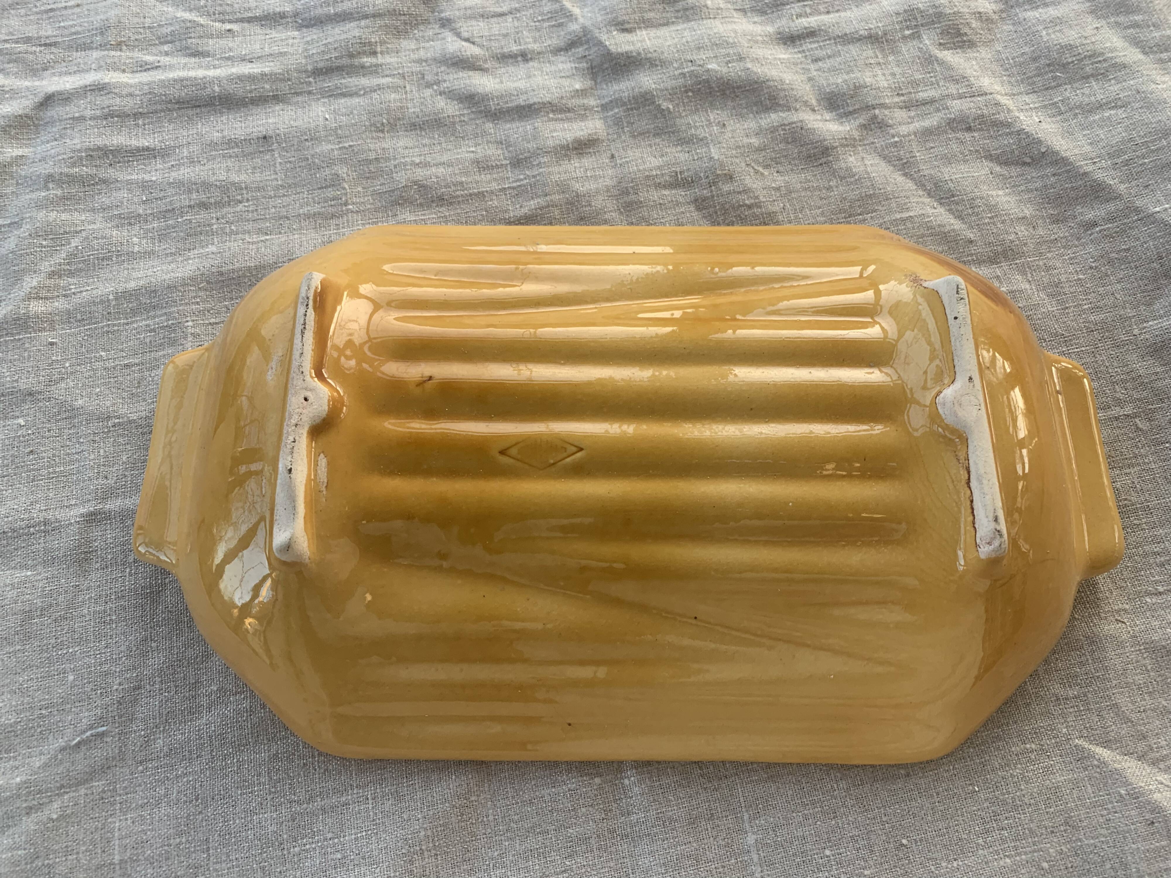 Vintage slip glazed ceramic asparagus dish