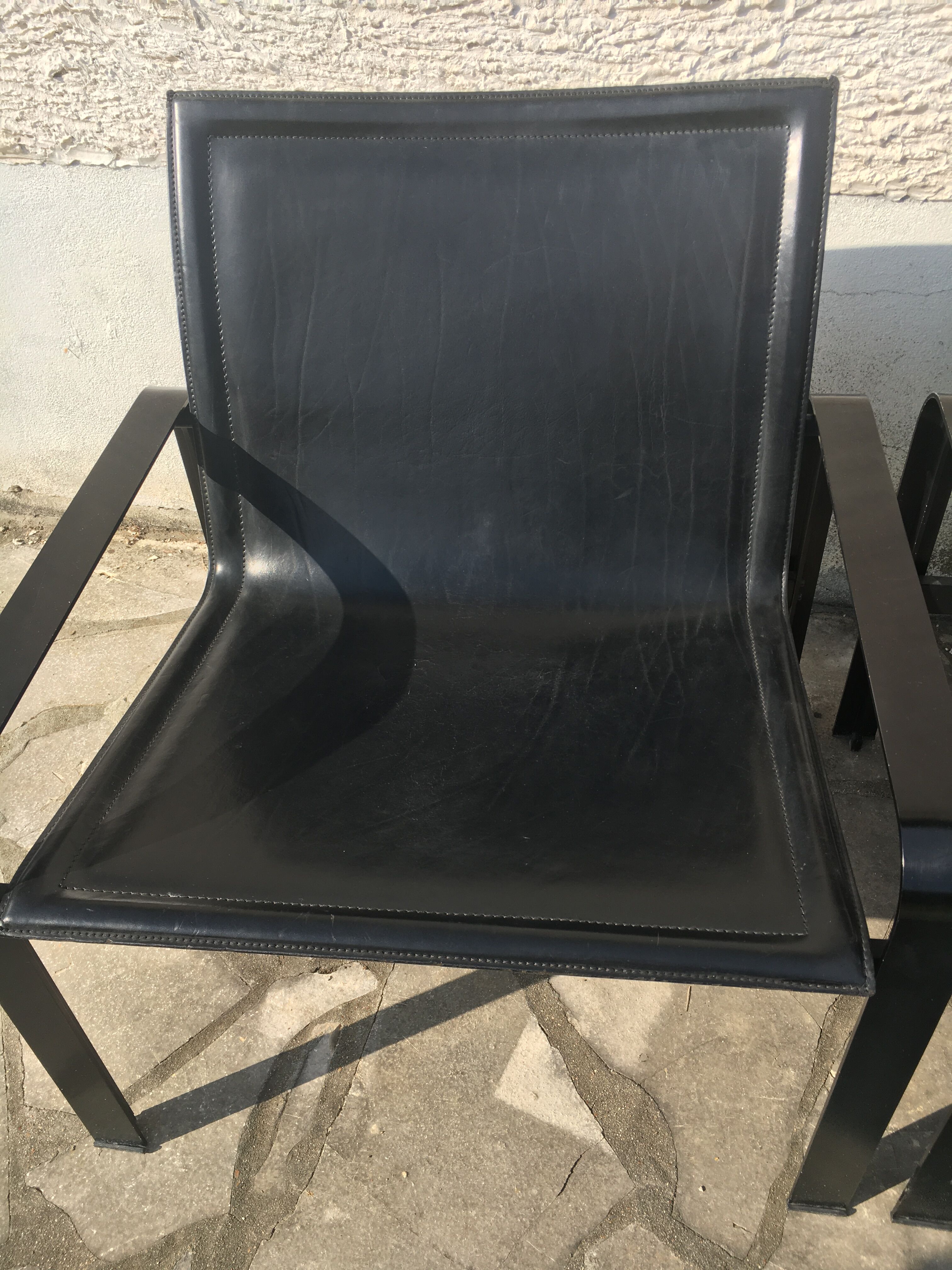 Pair of leather and metal chairs 70s