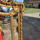 Large closed mirror, 19th century, wood and gilded stucco.