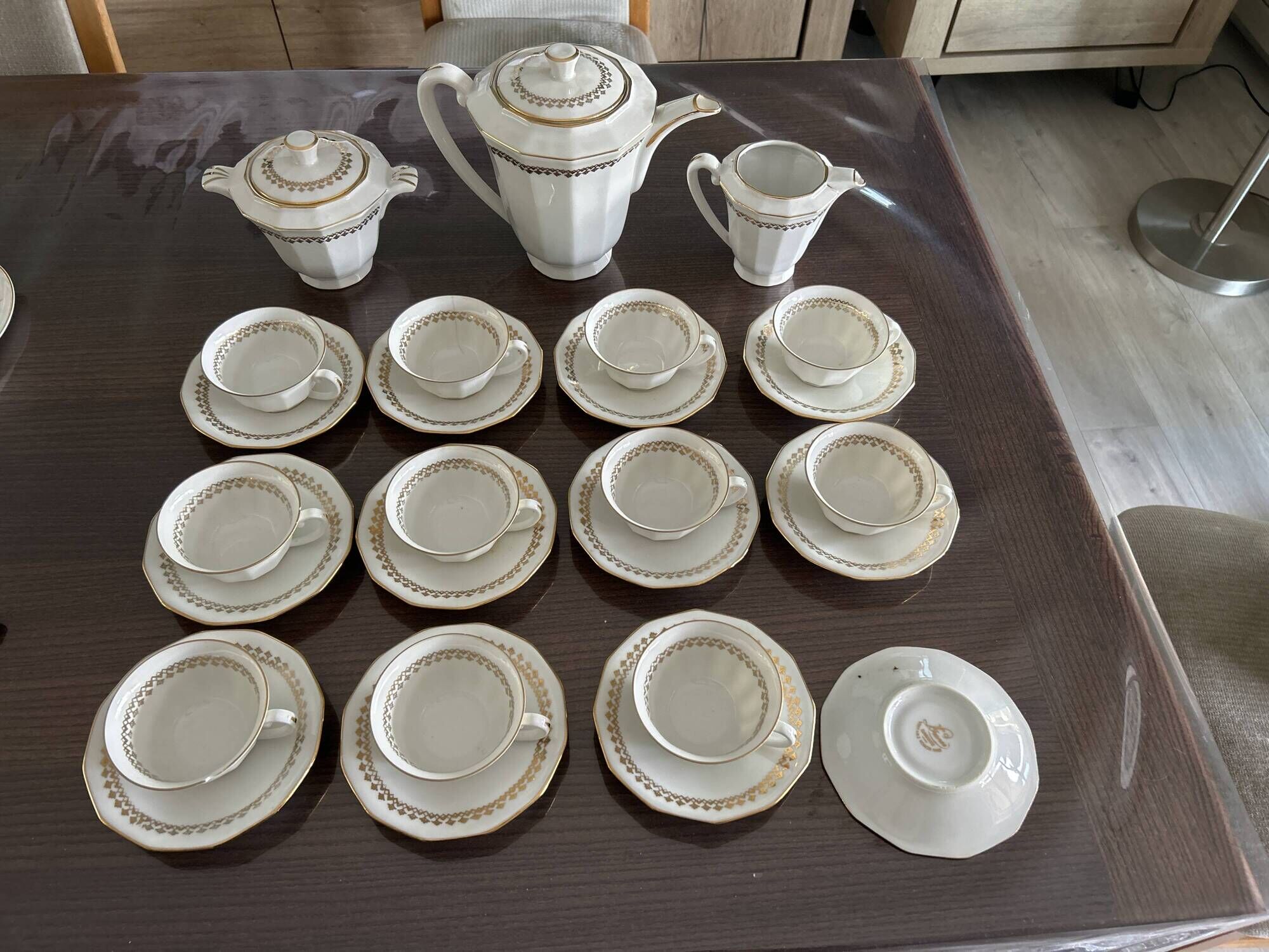 a vintage coffee or tea set in white porcelain with patterns and