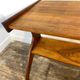 Table d'appoint sculpturale sur roulettes, bois massif, années 1950
