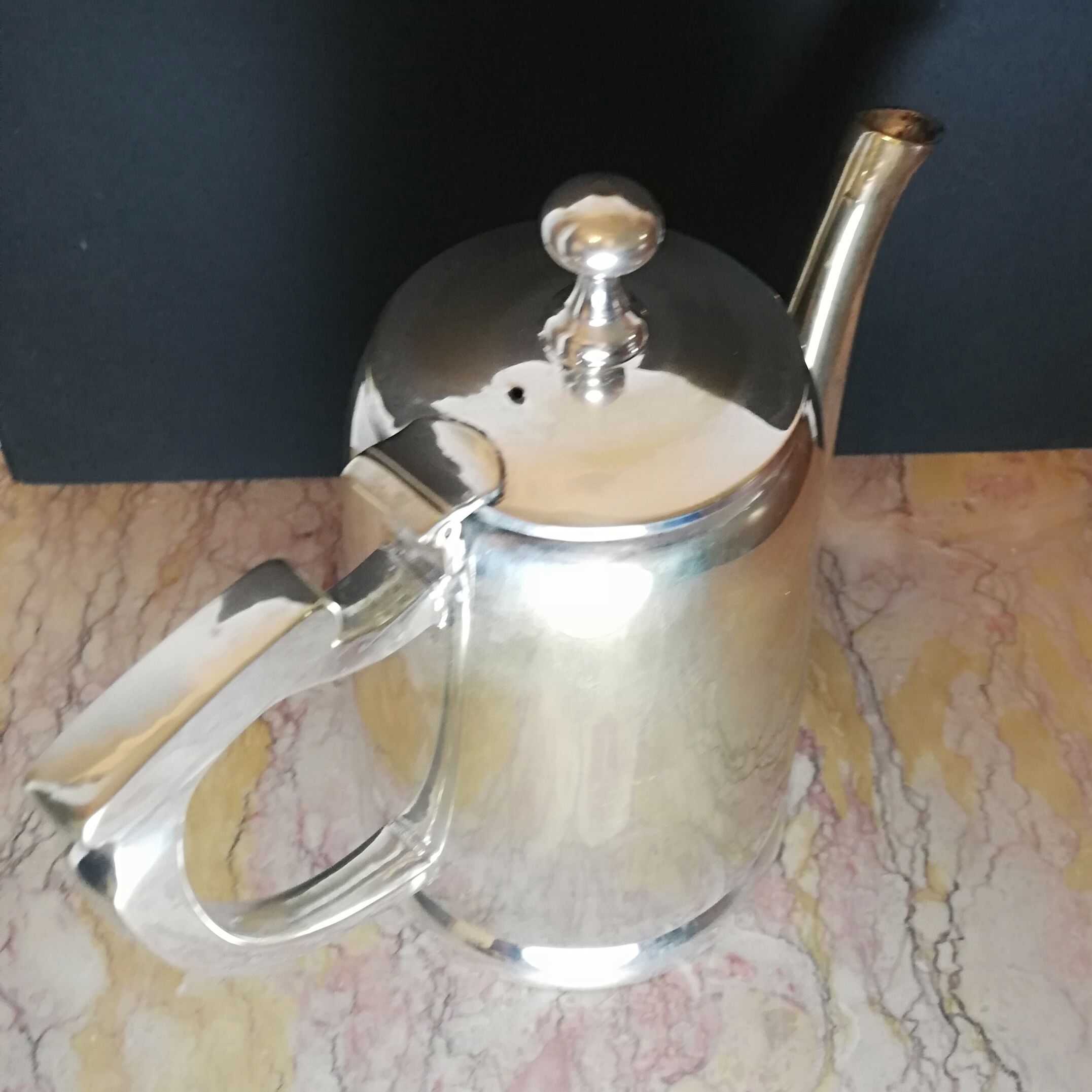 Art deco teapot in silver metal and vermeil reflections