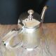 Art deco teapot in silver metal and vermeil reflections