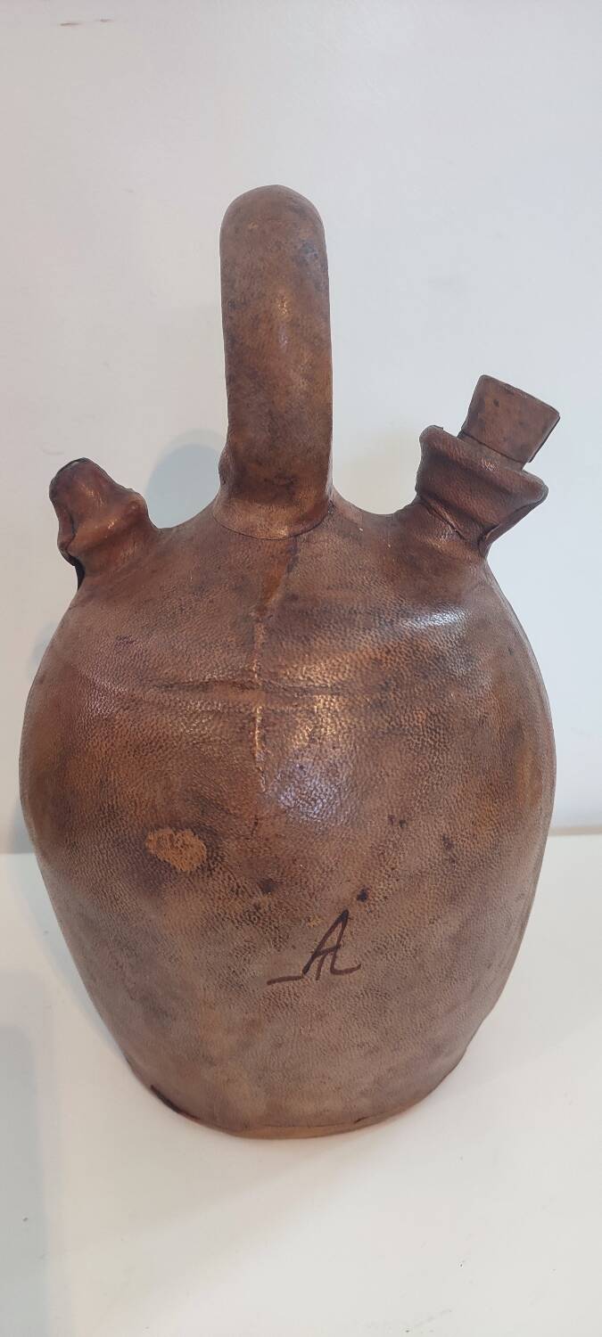Gargoulette, terracotta jug covered with leather