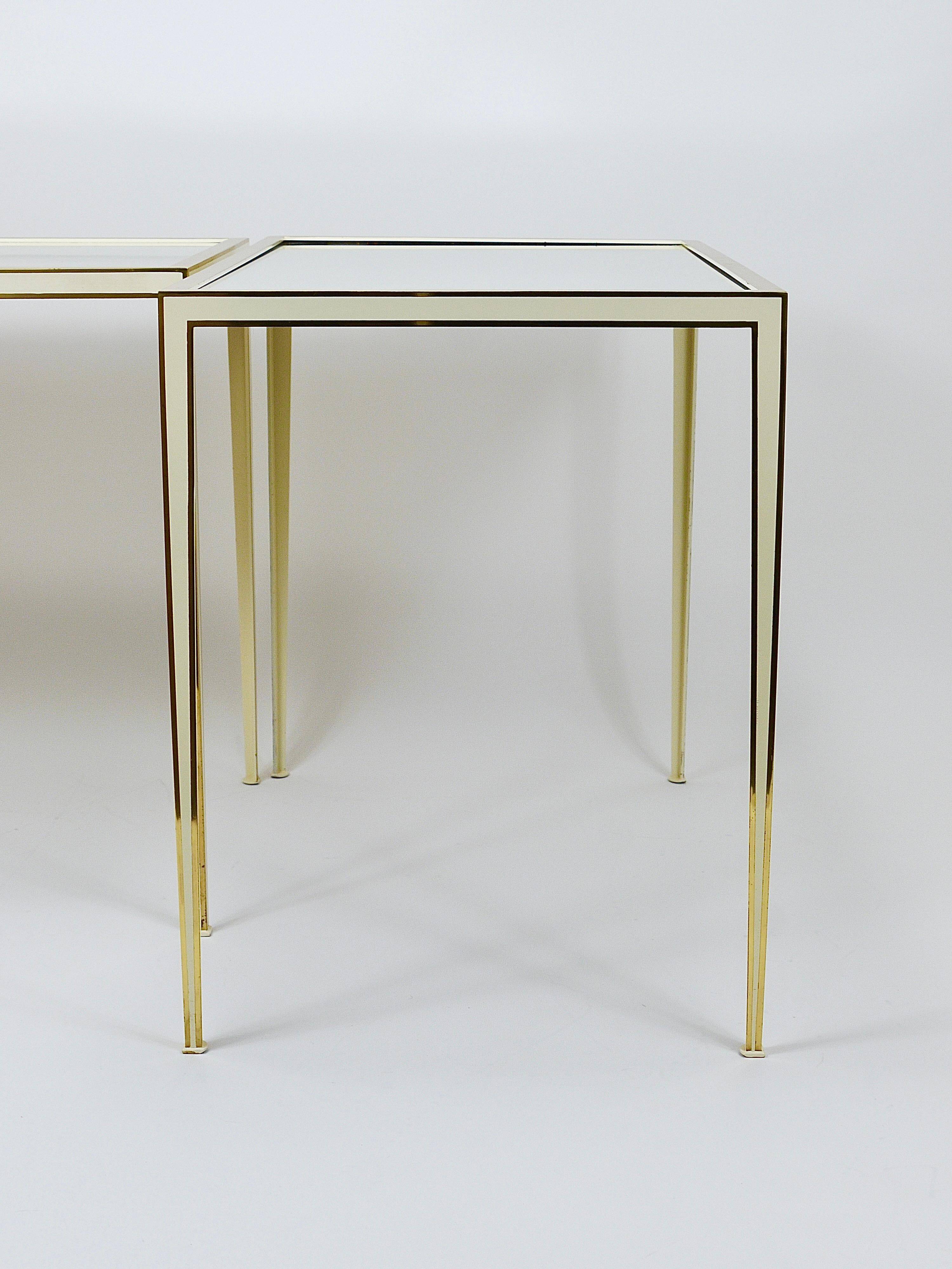 A pair of brass and white mirror tables from Vereinigte Werkstätten, Germany, 1970s.