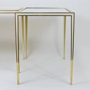A pair of brass and white mirror tables from Vereinigte Werkstätten, Germany, 1970s.