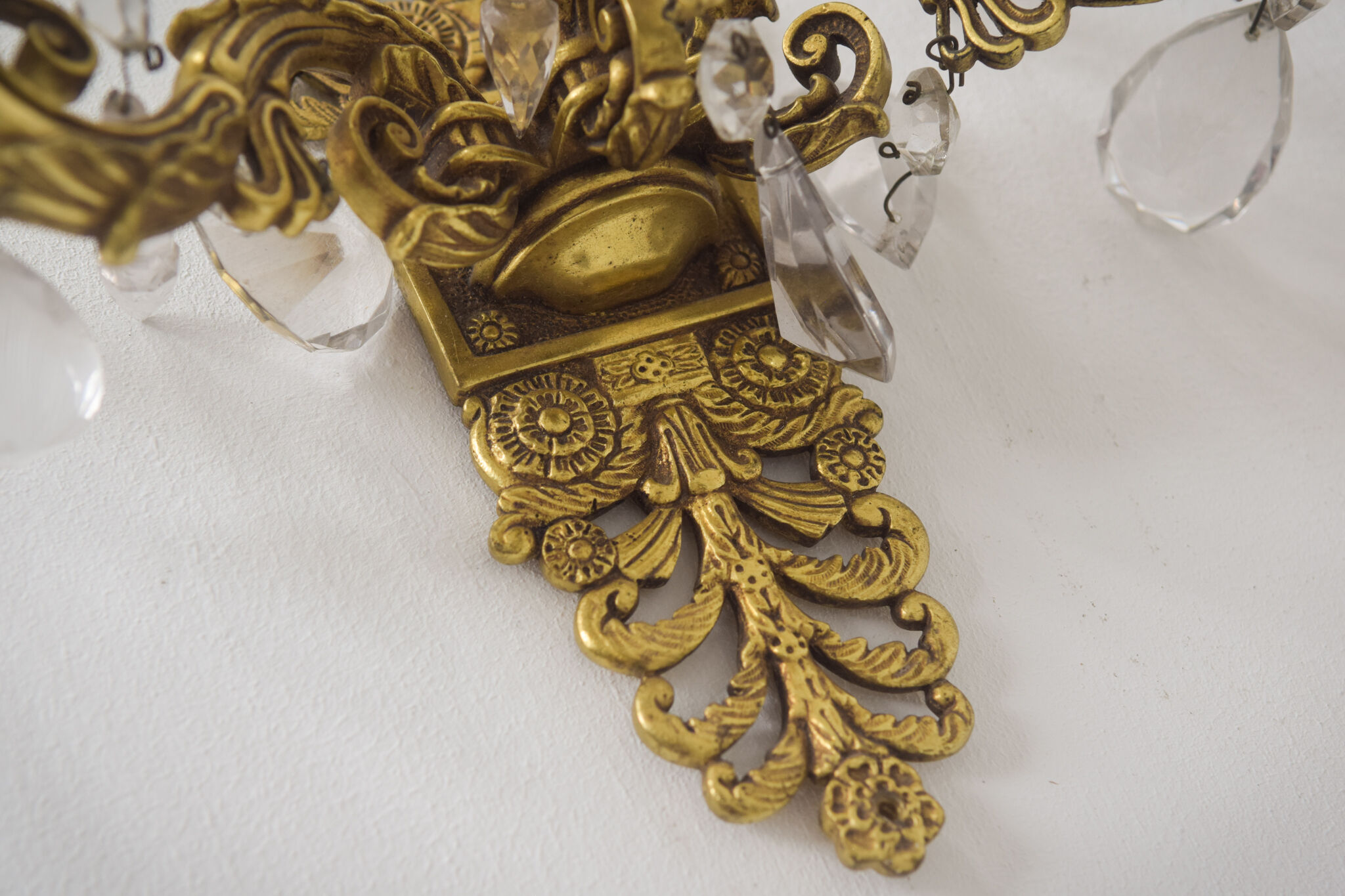 Two bronze and cut glass wall-mounted chandeliers