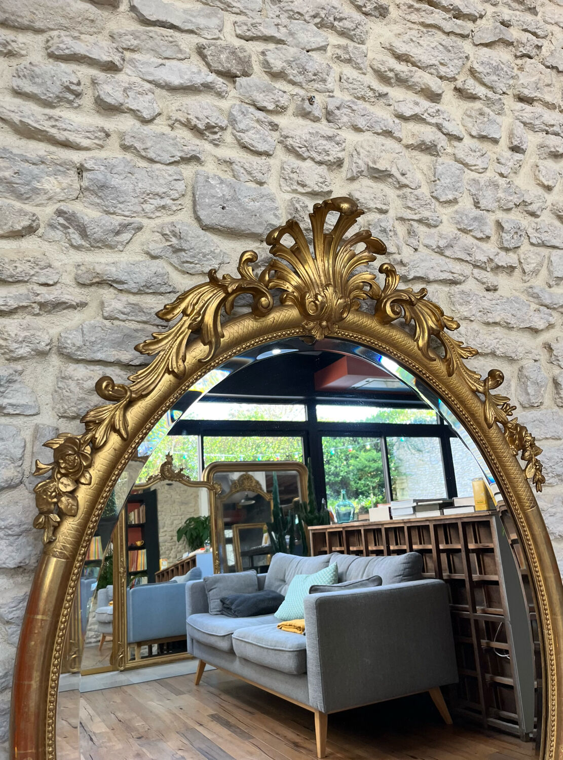 Oval mirror with pediment, beaded gilded with gold leaf