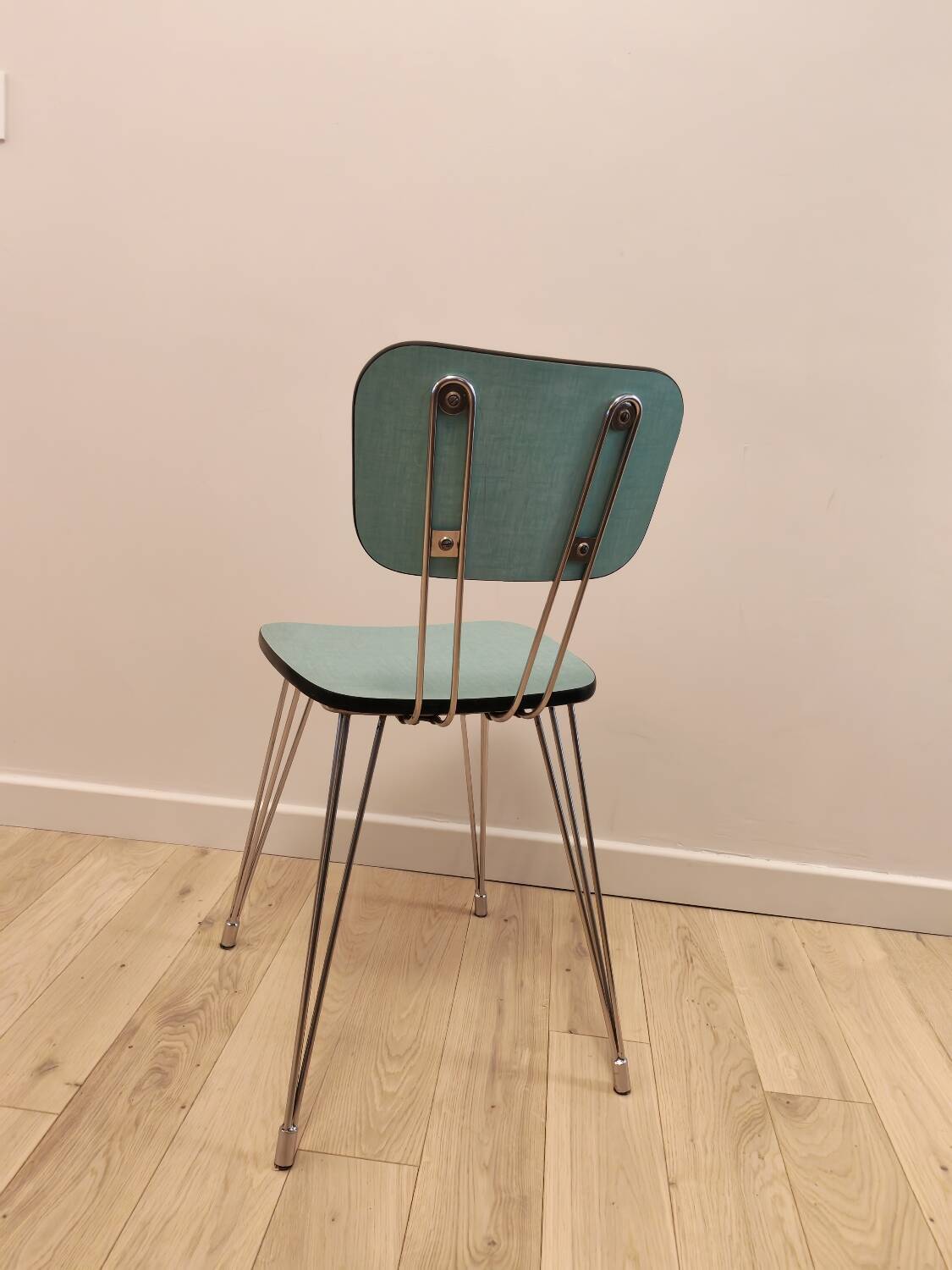 Pair of green Formica chairs with Eiffel legs