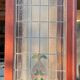Late 19th century store doors, haberdashery front with Art Nouveau stained glass windows