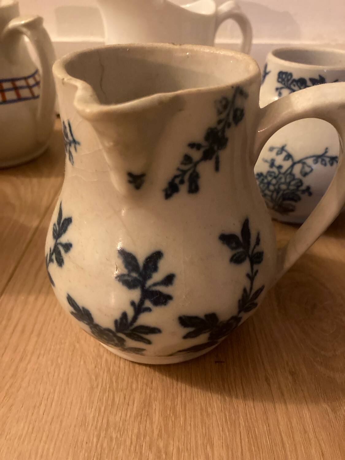 During antique milk jugs at a flea market.