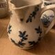 During antique milk jugs at a flea market.