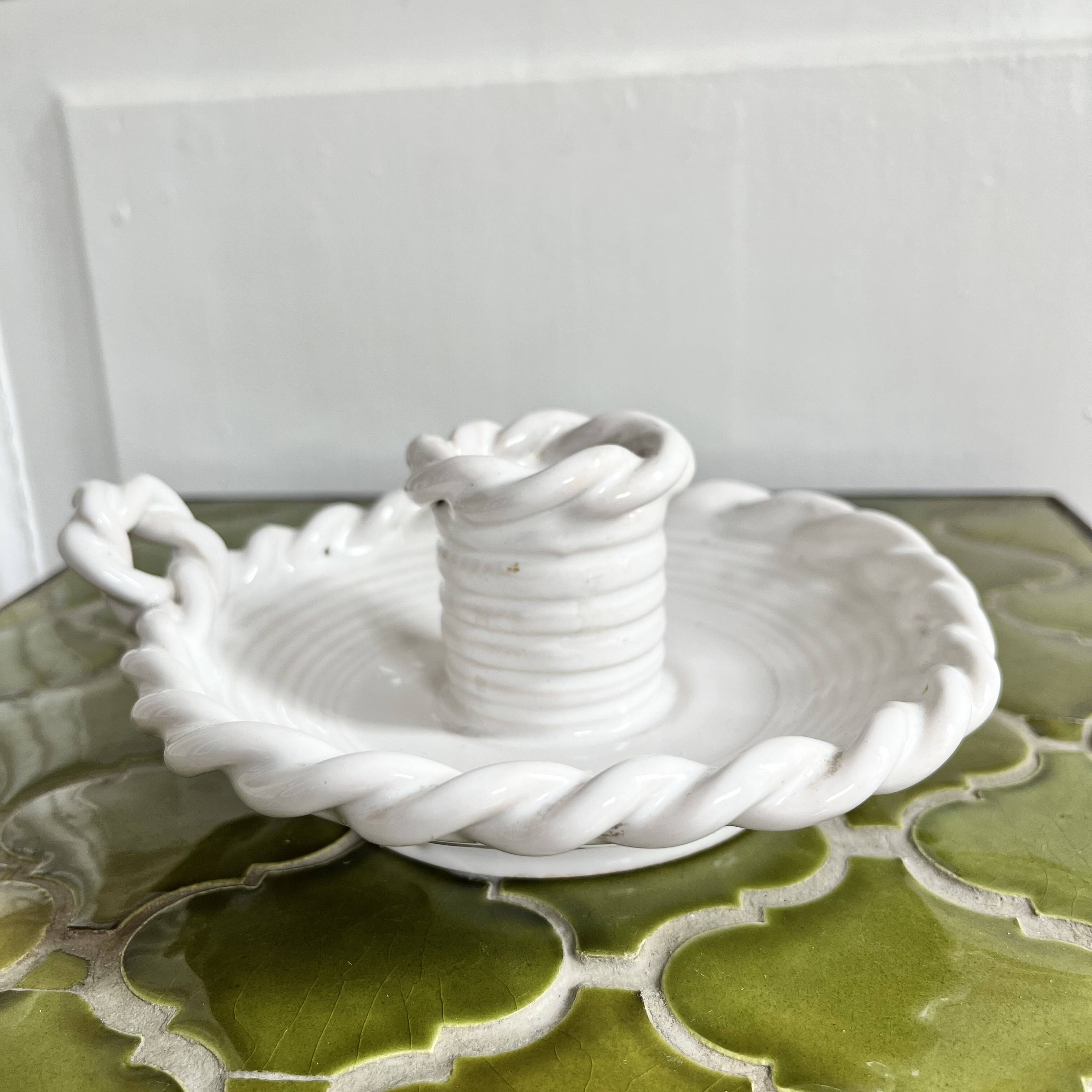 Hand-held candle holder with braided ceramic bowl
