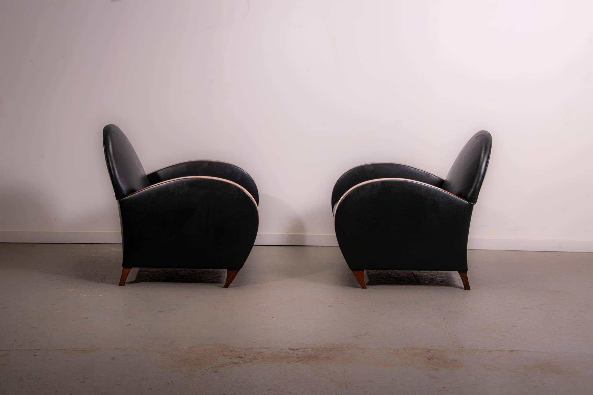 Pair of mid-century leather armchairs, circa 1970, made in Belgium.