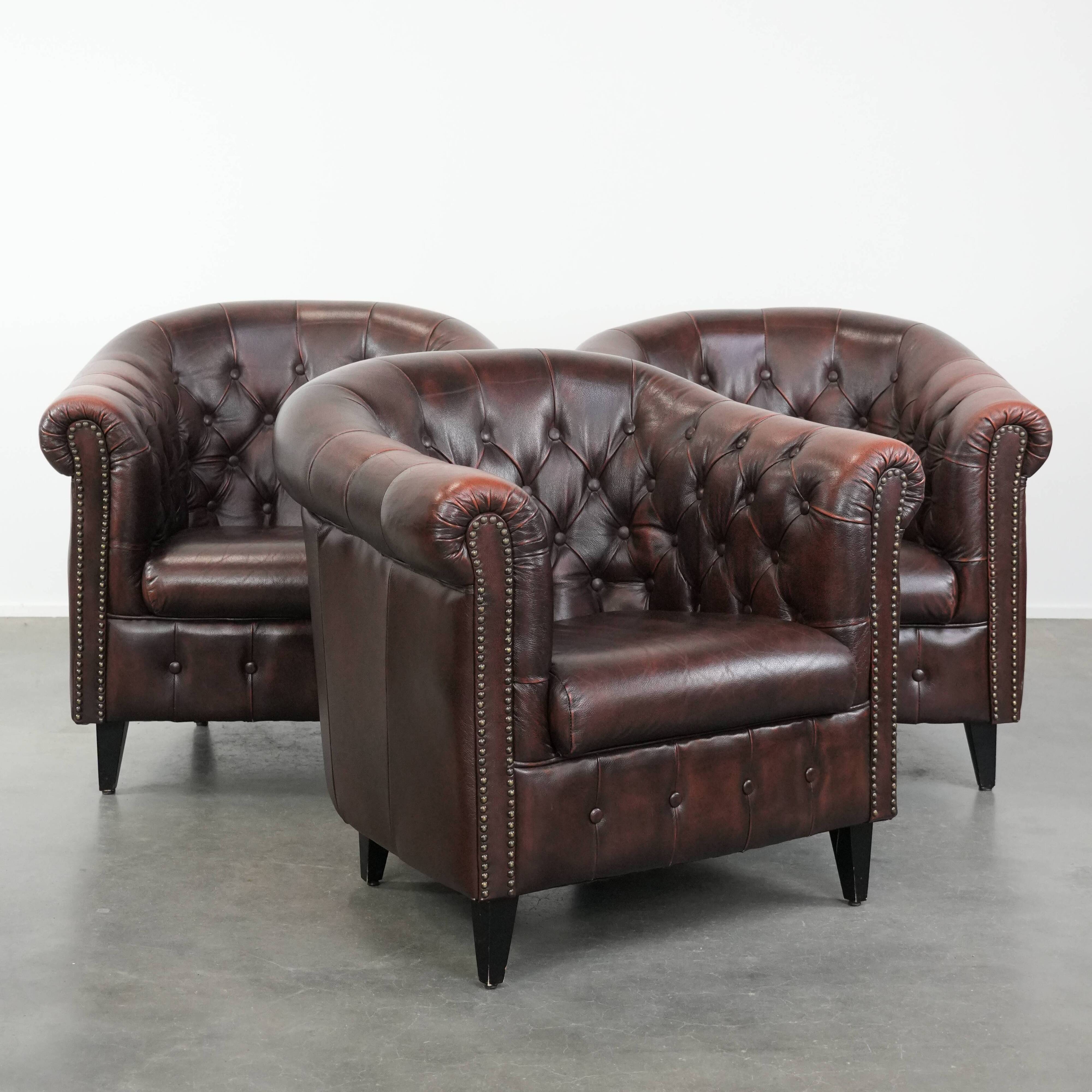 Set of three classic English-style Chesterfield cowhide  club armchairs